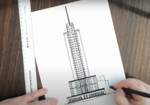 Zeichnen von Gebäuden um einen Wolkenkratzer